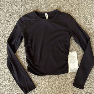 NWT Lululemon cropped long sleeve, size 4!